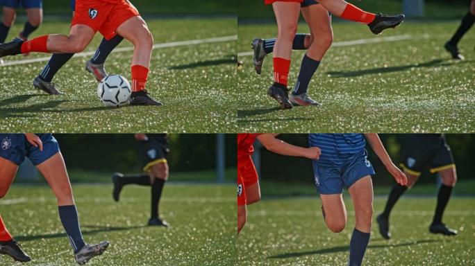 一名女子足球运动员在超越对手时踢球的SLO MO TS腿