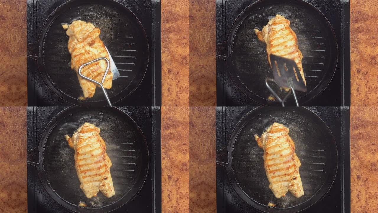 烤盘上翻转的美味烤鸡肉鱼片的俯视图