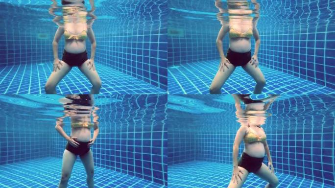 孕妇在游泳池锻炼。