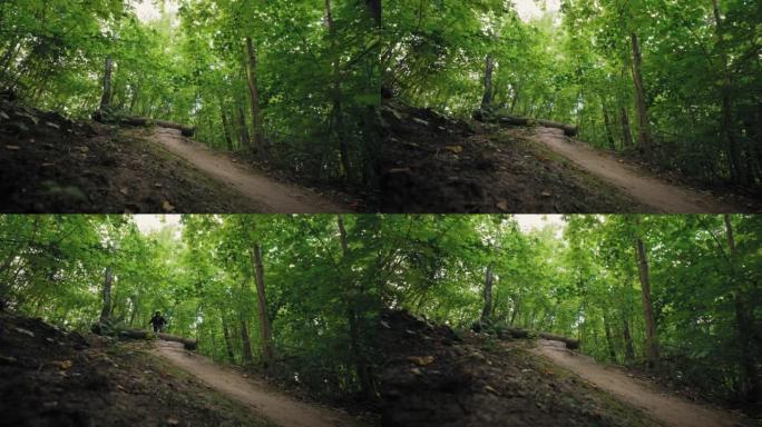 山地自行车骑手在森林步道上高速行驶