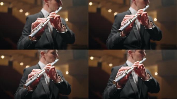 专业长笛演奏家在歌剧院或爱乐音乐厅演奏长笛，音乐家的肖像