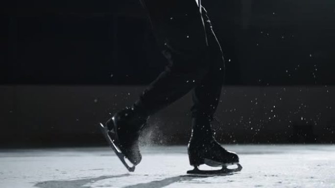 单人花样滑冰运动员正在溜冰场上进行步骤序列，脚踩溜冰鞋的特写镜头，冠军正在比赛中执行他的程序