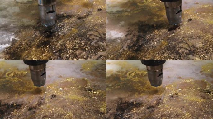 电动烘干机的特写镜头，将流体丙烯酸涂料吹散，与环氧树脂混合在画布上。流体艺术绘画。