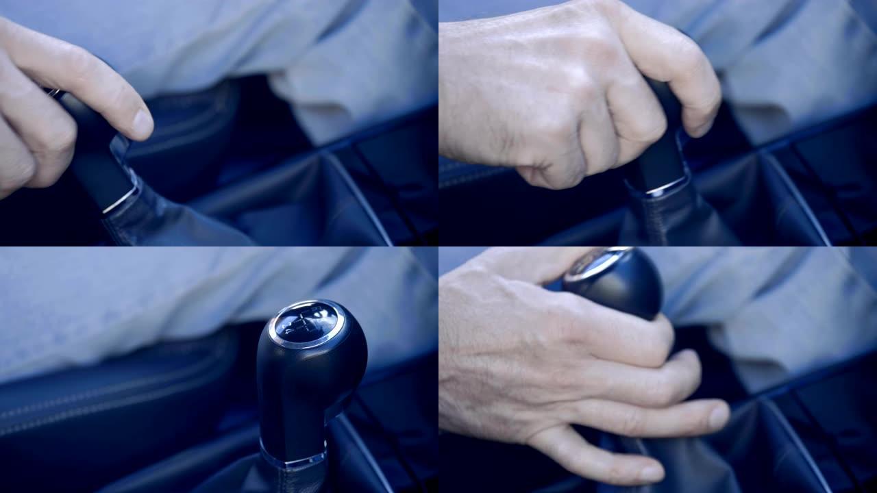 驾驶员的手拿一个杠杆并啮合变速器中的齿轮