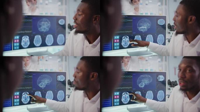 实验室设备和计算机。屏幕上的脑电波研究。非洲族裔科学家讨论