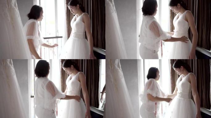 裁缝在身体周围测量，试穿婚纱。
