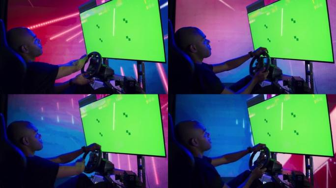 绿屏显示专业游戏锦标赛设置与方向盘。Esport boy gamer