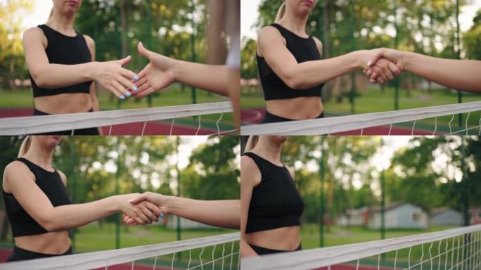 年轻的运动女性在网球场上握手，特写镜头，慢动作，健康的生活方式