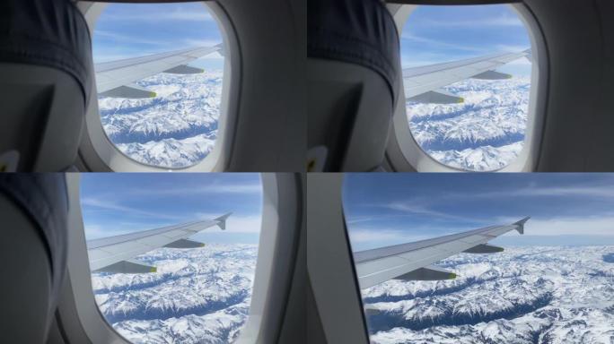 从阿尔卑斯山上空的飞机窗户拍摄的视图细节