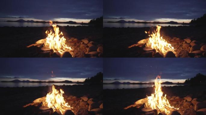 日落时海湾附近山脊上方篝火的细节拍摄