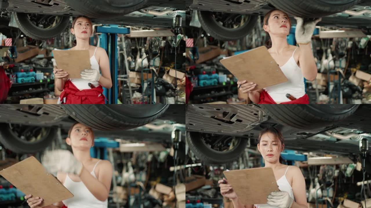 女发动机工程师在汽车修理厂修理汽车