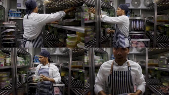 拉丁美洲厨师在一家餐厅工作，在冷藏室寻找一些食材