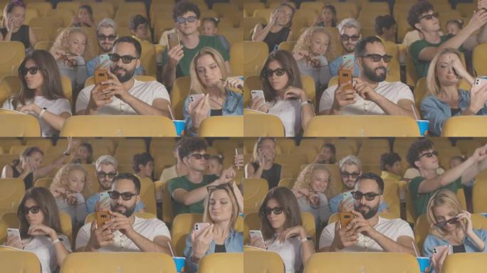 一群电影-喜欢在3d电影中拍摄电影之前使用智能手机。在电影院首映前，放松的多民族男女自拍和上网的肖像