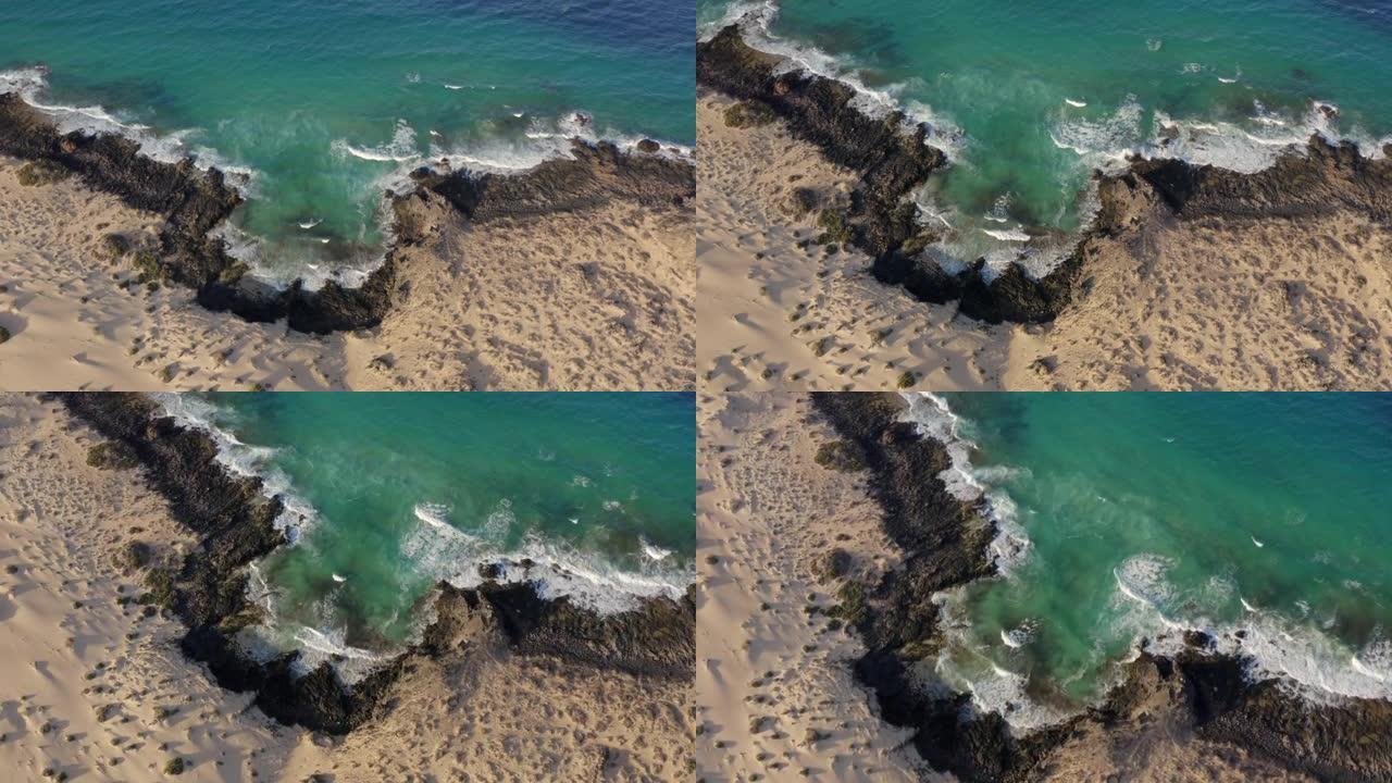 空中无人机拍摄了多岩石的海岸线波浪细节