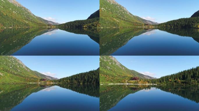阳光明媚，秋天的一天在波兰塔特拉山脉的莫尔斯基奥科湖。无人机的观点。在水中反射的庇护所