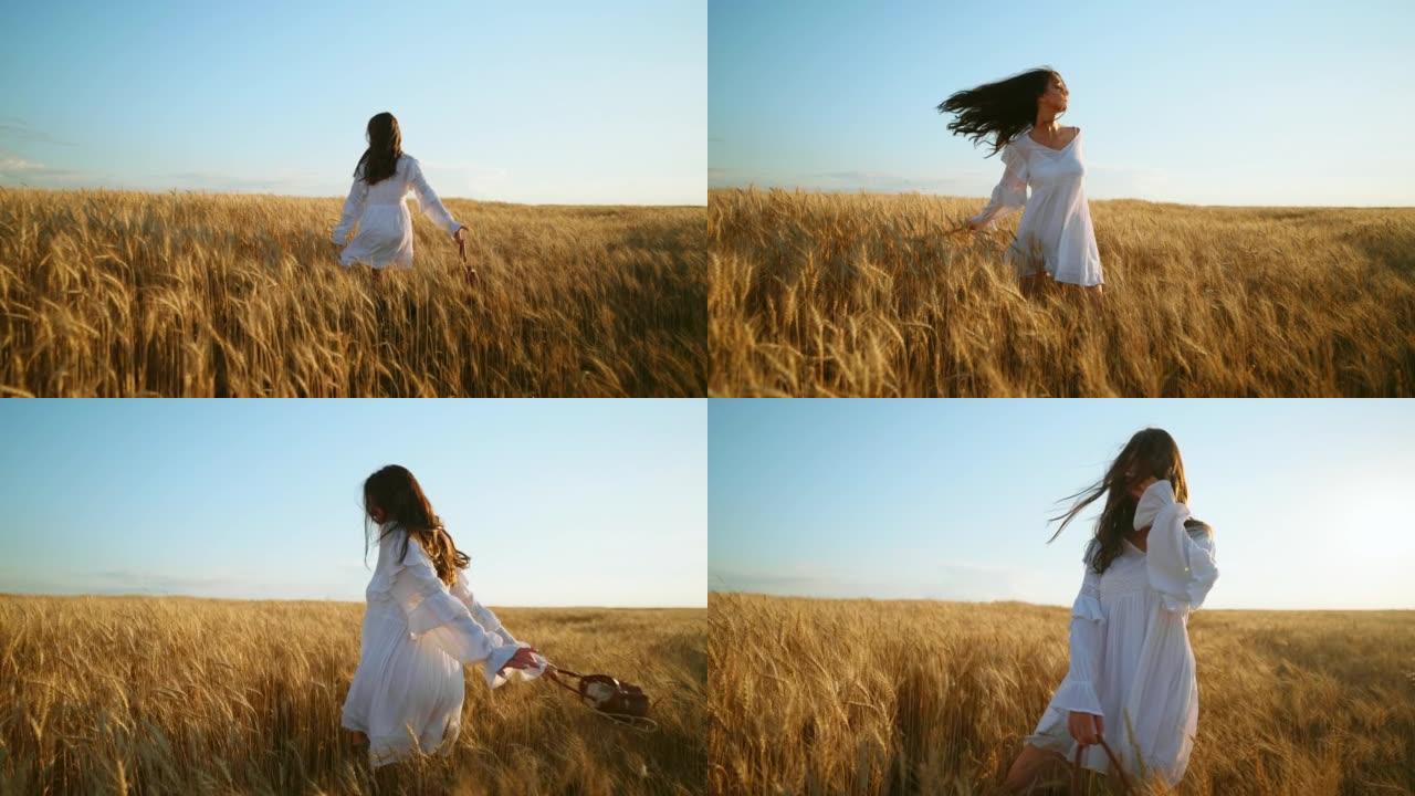 穿着乡村风格的白色连衣裙的优雅女人独自走在美丽的麦田里，后视，慢动作
