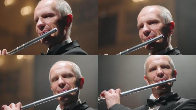 middle aged flutist is playing flute, portrait sho