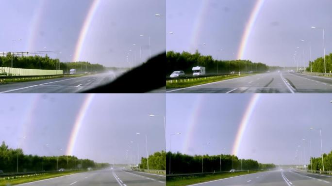 POV汽车驾驶。在雨中追逐彩虹