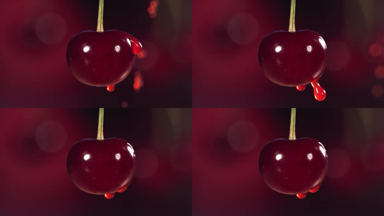 慢动作从深红色背景的新鲜樱桃中掉落的果汁