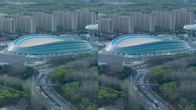 北京冰丝带国家速滑馆日转夜延时摄影-竖版