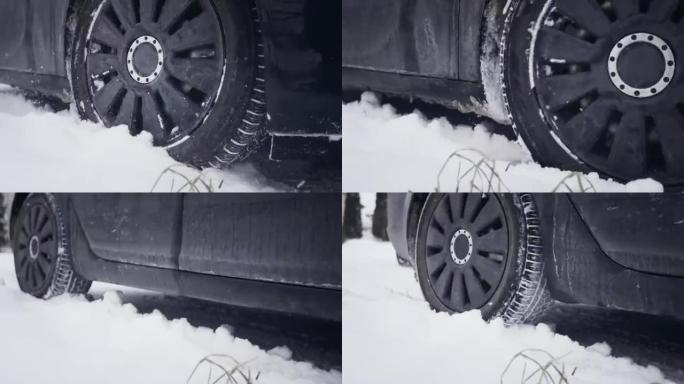 汽车在雪地上行驶冬季轮胎特写
