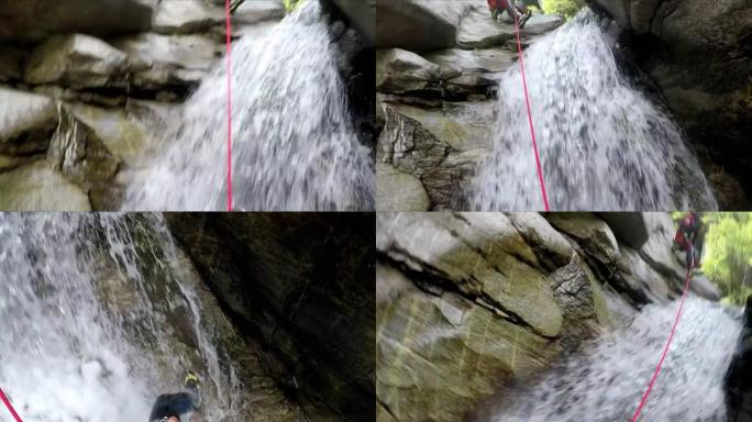一名男性峡谷者沿着瀑布下降的第一人称视角