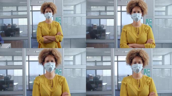 SLO MO肖像一名戴着防护面具站在办公室的年轻女子