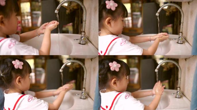 亚洲女孩洗手后玩得很开心。