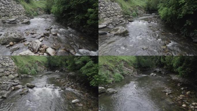 空中无人机拍摄有岩石和树木的河流