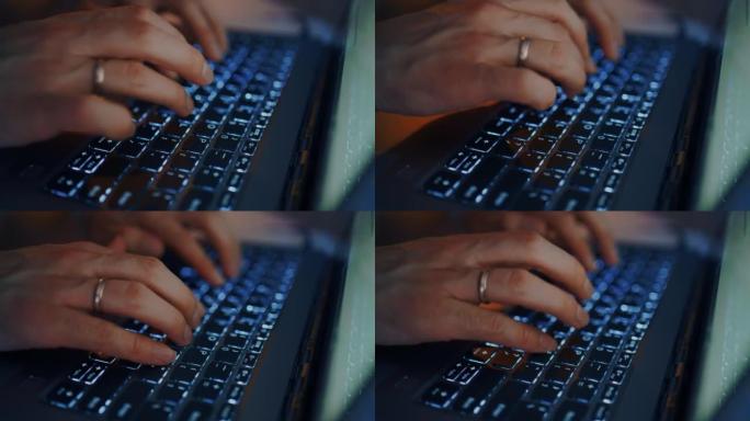 男人正在笔记本电脑的键盘上键入消息和文本，手指的特写视图，照明键