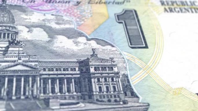 阿根廷比索纸币，一个阿根廷比索，阿根廷比索的特写和宏观视角，跟踪和多利镜头1阿根廷比索纸币观察和储备