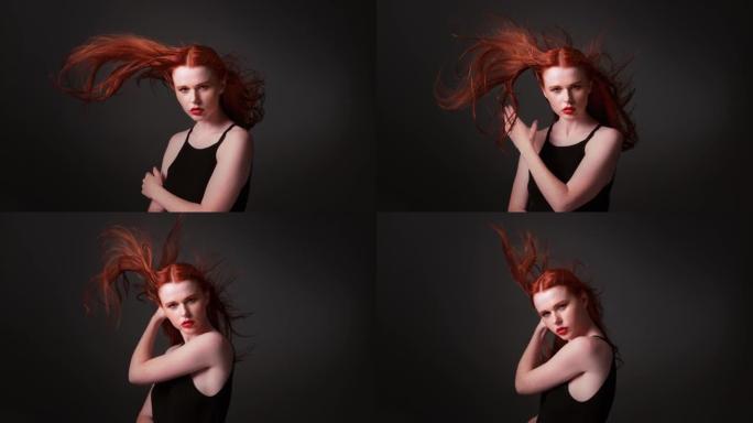美丽的红发女人，长长的健康的头发在风中挥舞。诱人的脸