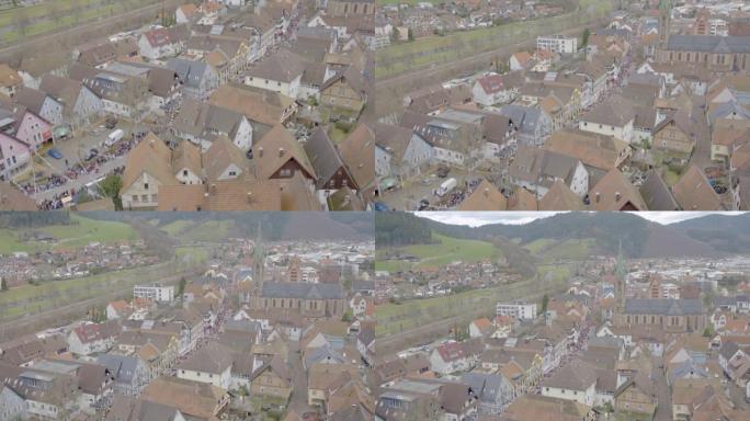 空中无人机拍摄了一个庆祝狂欢节的德国小镇
