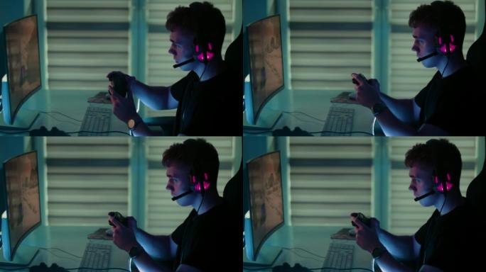 十几岁的男孩使用游戏手柄玩电脑赛车游戏