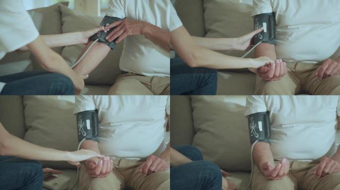 特写女医生在办公室测量老年病人血压