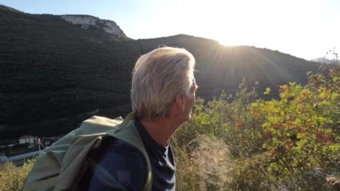 高级男性徒步旅行者上升叶状通道的第一人称视角