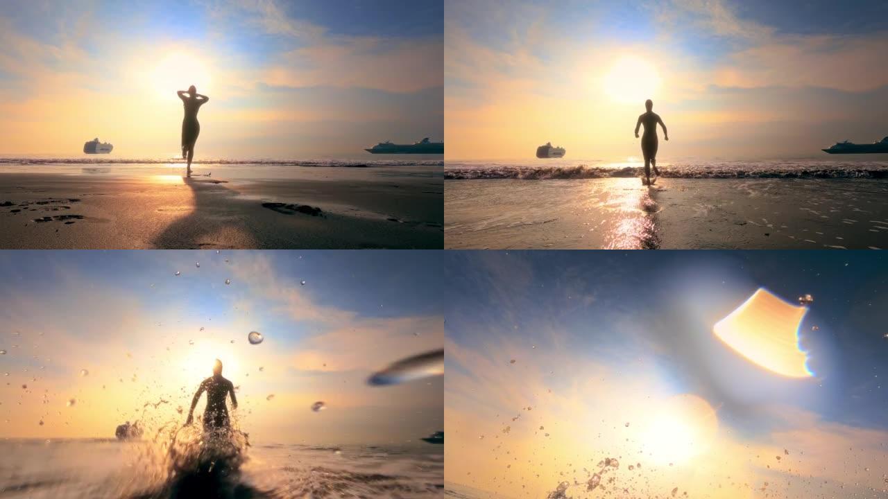 女人剪影固定她的泳衣，跑进海里。日落景观