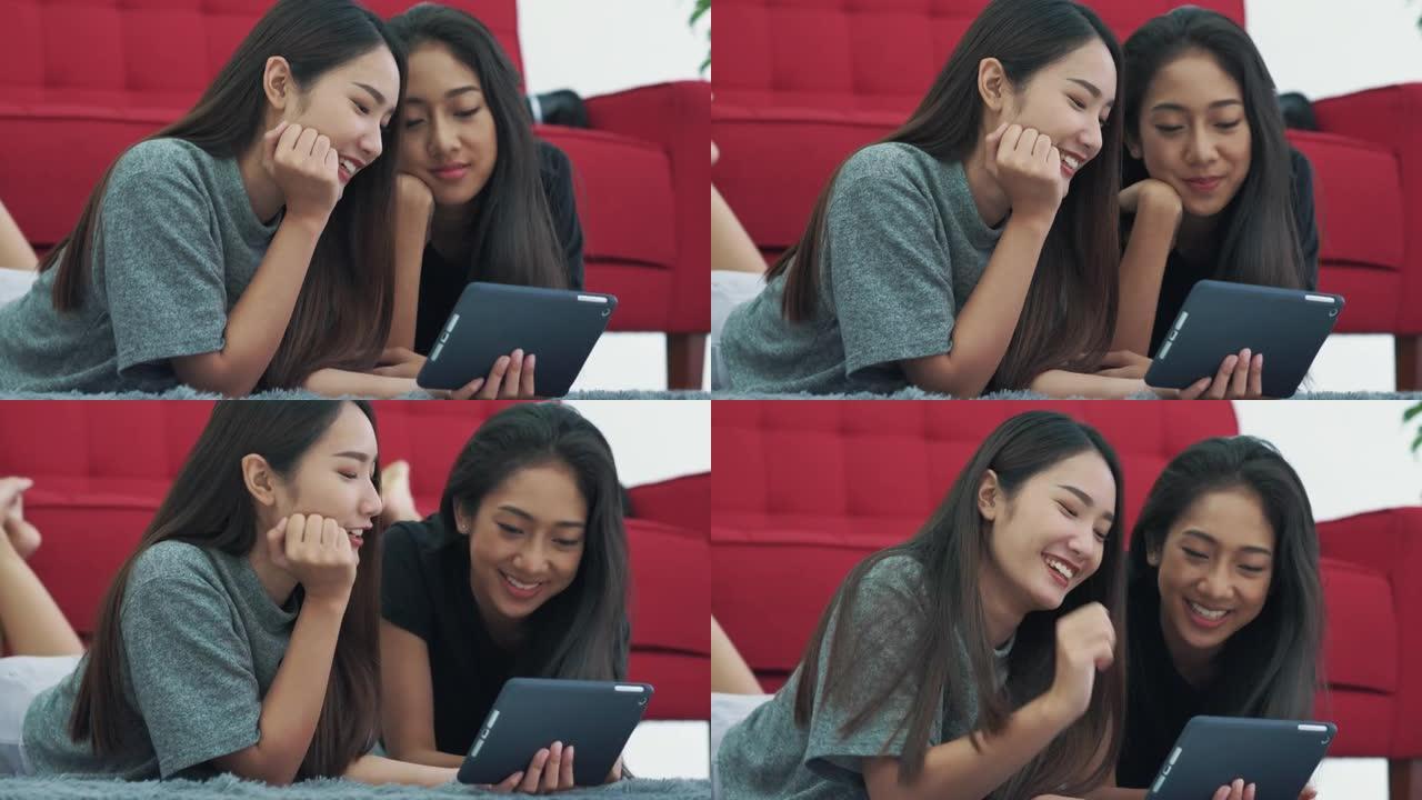 两名年轻女性在家中使用数字平板电脑