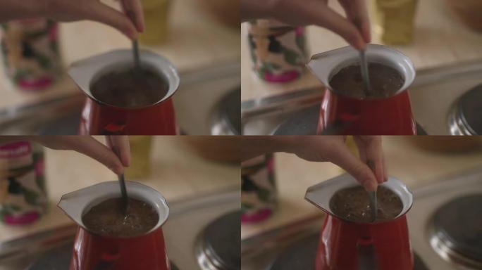 手搅拌咖啡的细节镜头