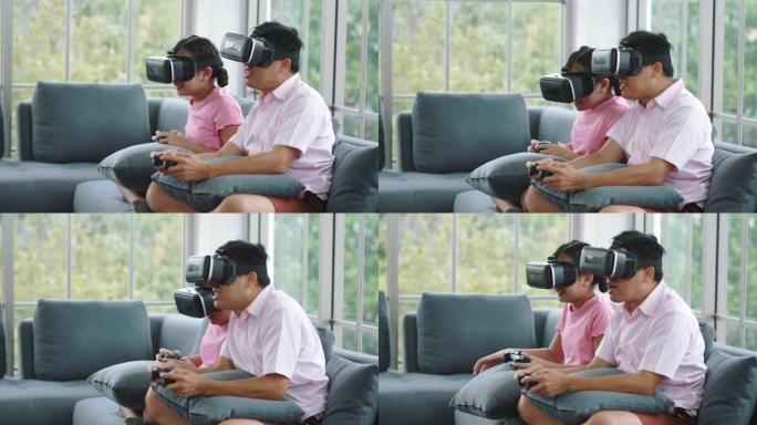 亚洲父亲和他的女儿在家里的客厅一起玩电子游戏