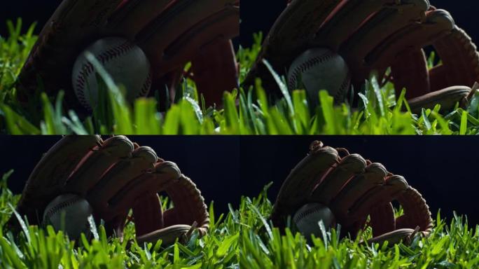 棒球在手套上休息，背景为黑色