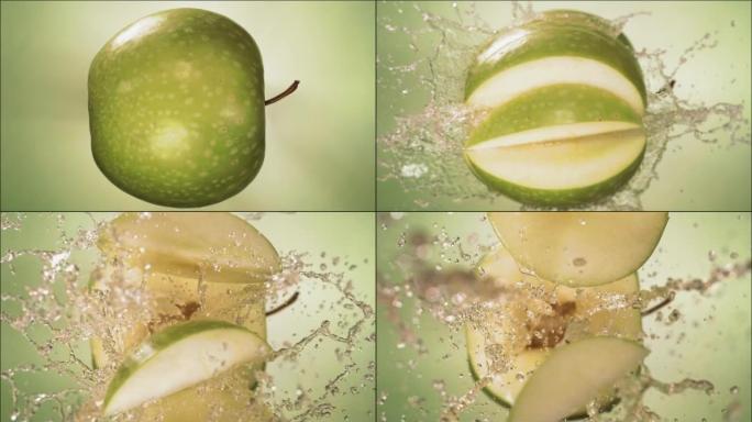 爆炸青苹果和爆裂果汁和切片的超慢动作