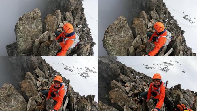 一队登山者沿着陡峭的山峰移动。对着镜头微笑。欧洲阿尔卑斯山