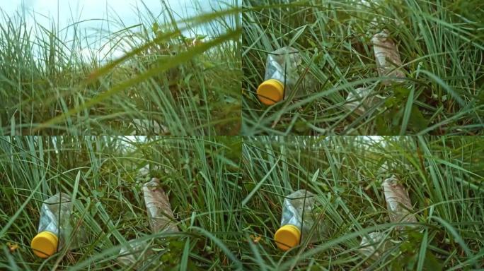 躺在草地上的塑料瓶