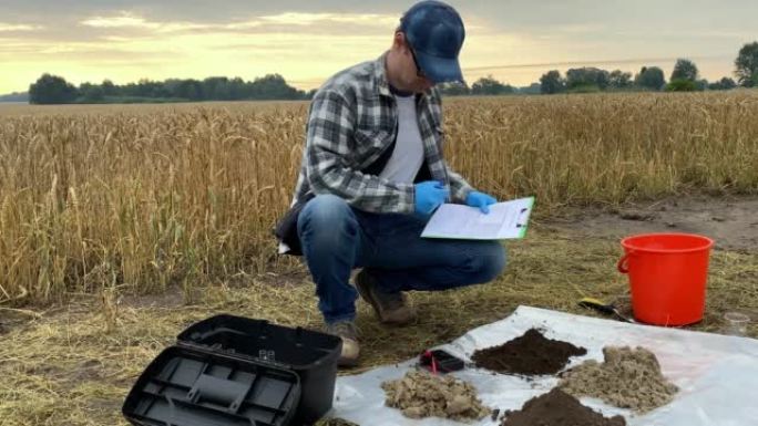科学家使用土壤研究装置，在野外黎明做记录
