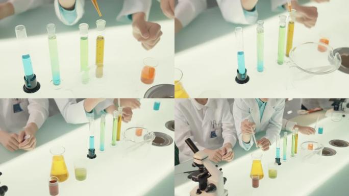 男孩在实验室进行科学实验。用移液器混合多色液体。特写