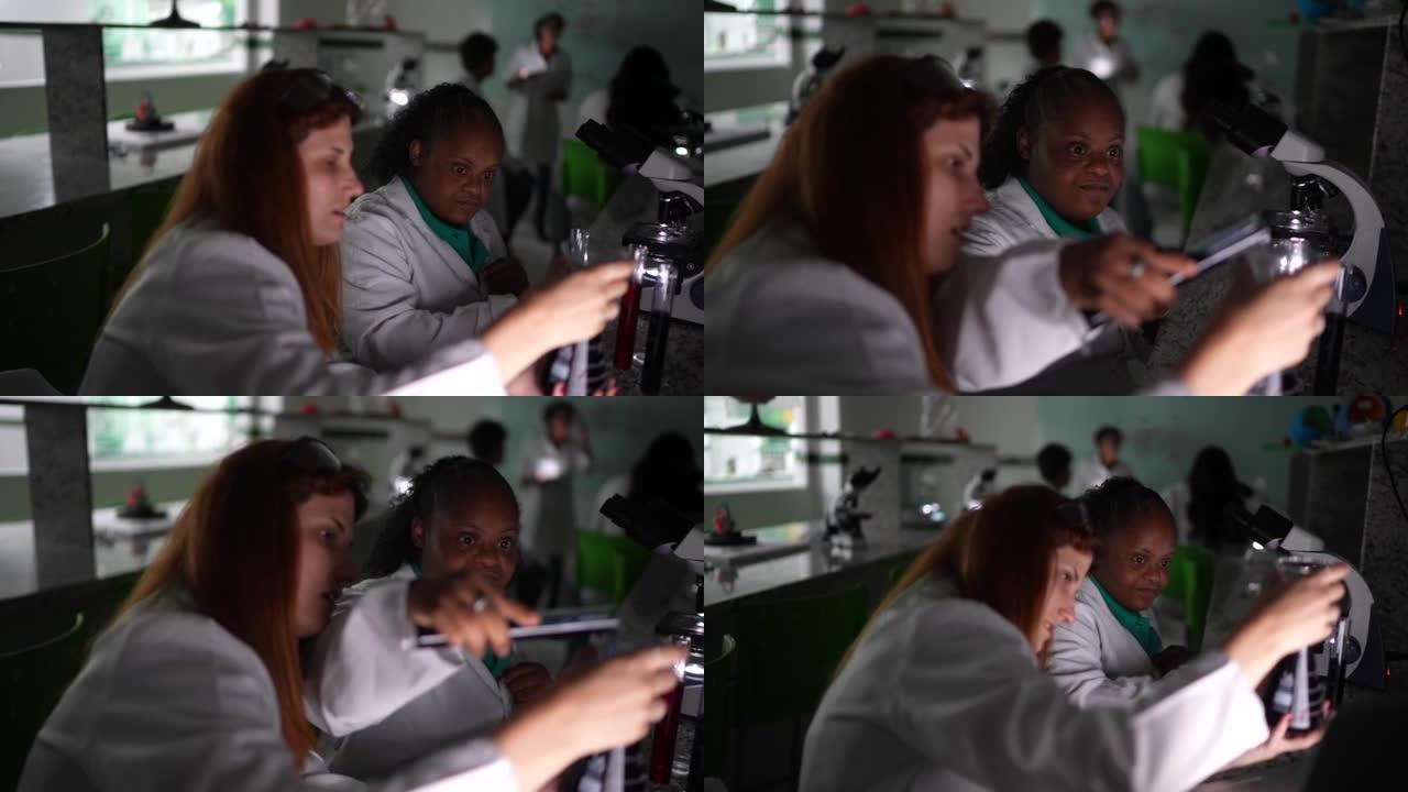 在实验室做实验的学生-包括一个残疾人