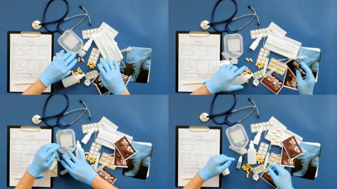 蓝色背景医学概念的医生桌顶视图