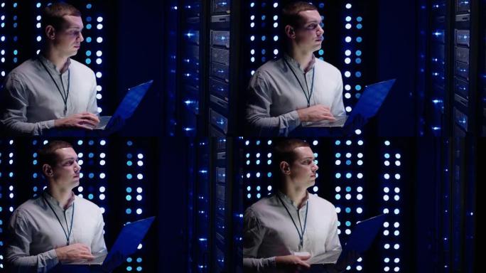 信息数字化的概念: IT专家站在笔记本电脑的服务器机架前，他用触摸手势激活数据中心。网络数据