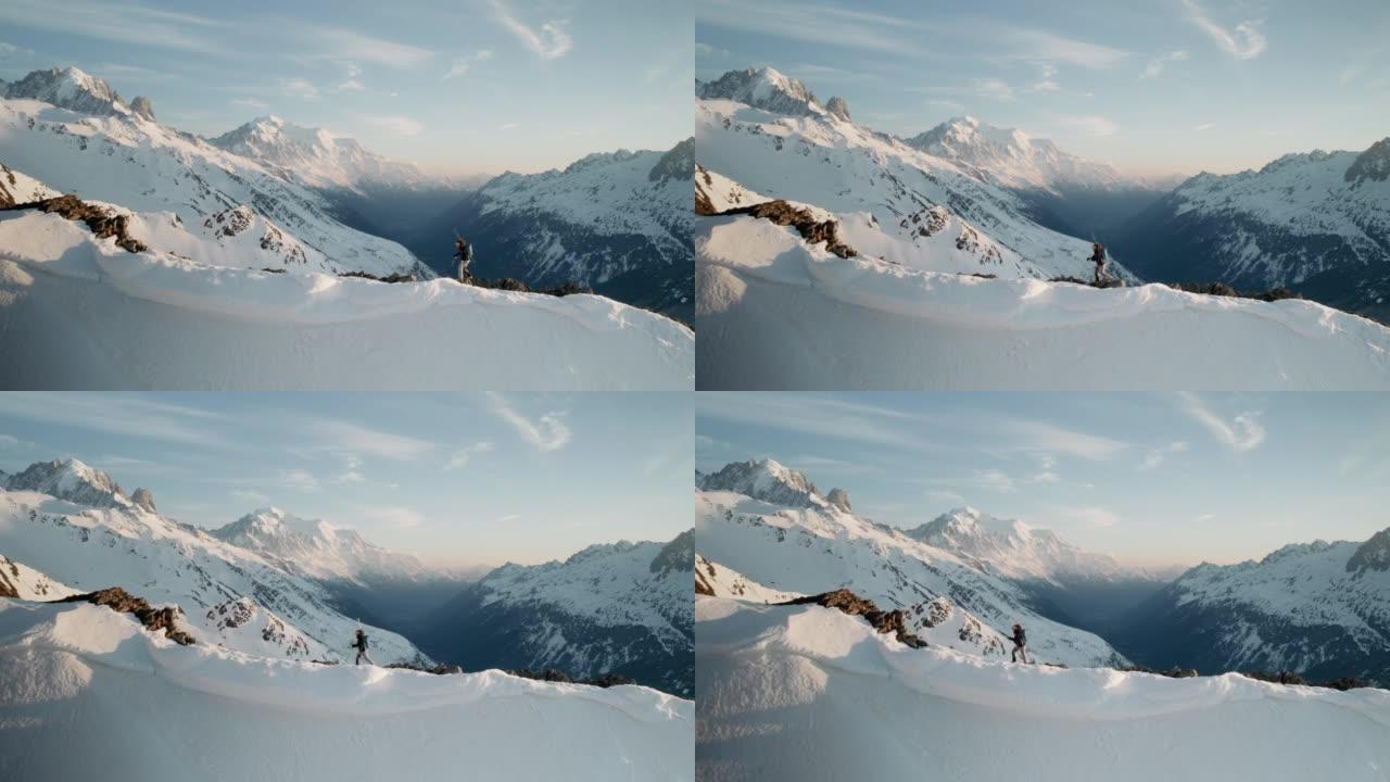 女登山者滑雪游览白雪皑皑的山脊，欣赏勃朗峰